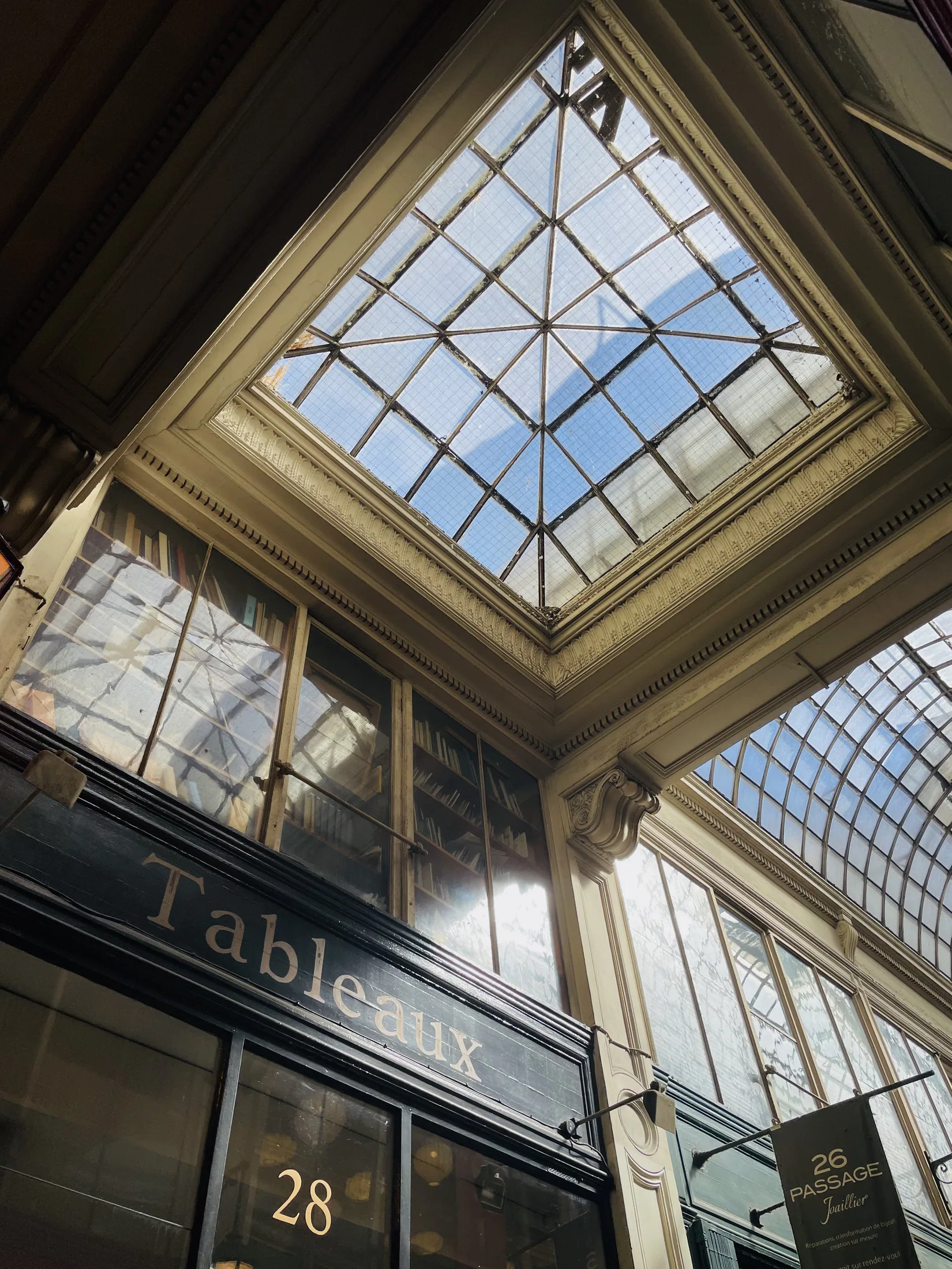 Light falling through the glass roof of a Parisian passage